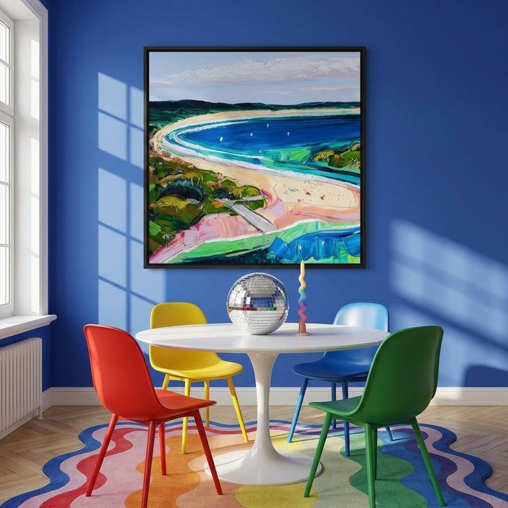 Canvas wall art with a black surround styled on the wall in a colourful eclectic dining room