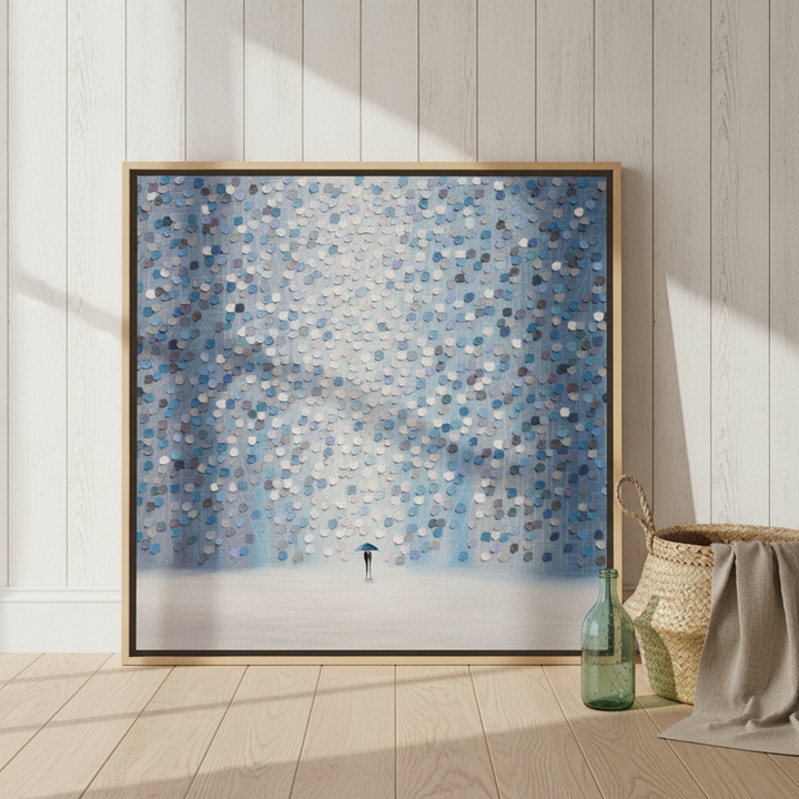 Oversized statement canvas wall art with a natural timber surround leaning against the wall in a coastal bedroom