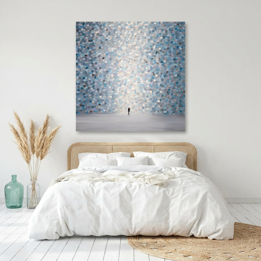 Stretched canvas wall art styled on the wall in a coastal bedroom