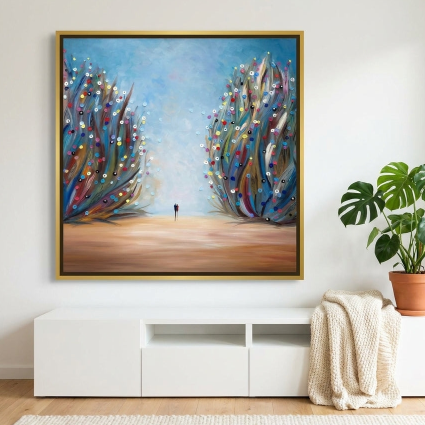 Canvas wall art with a gold leaf surround styled on the wall in a bright Scandinavian living room