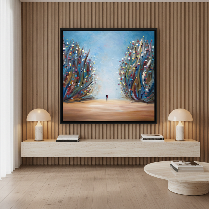 Oversized statement canvas wall art with a black surround styled on the wall in a luxe living room