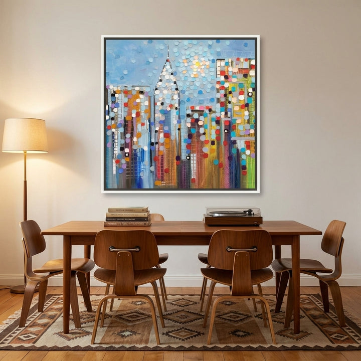 Canvas wall art with a white surround styled on the wall in a mid-century dining room