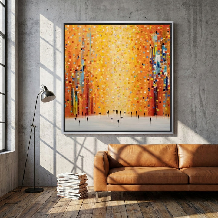 Oversized statement canvas wall art with a silver leaf surround styled on the wall in an industrial loft living room