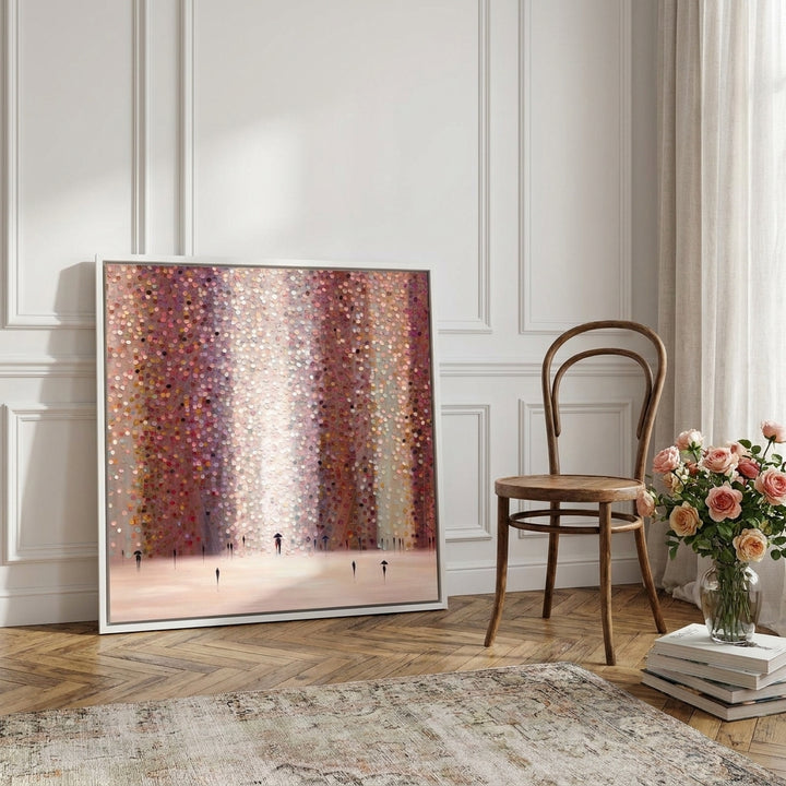 Canvas wall art with a white surround leaning against the wall in a Parisian dining room