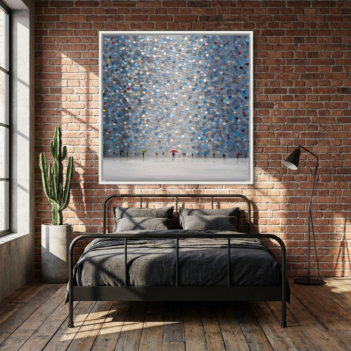 Canvas wall art with a white surround styled on the wall in an industrial loft bedroom