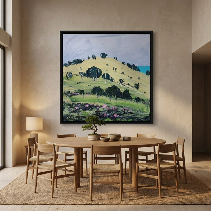 Oversized statement canvas wall art with a black surround styled on the wall in a warm Japandi dining room