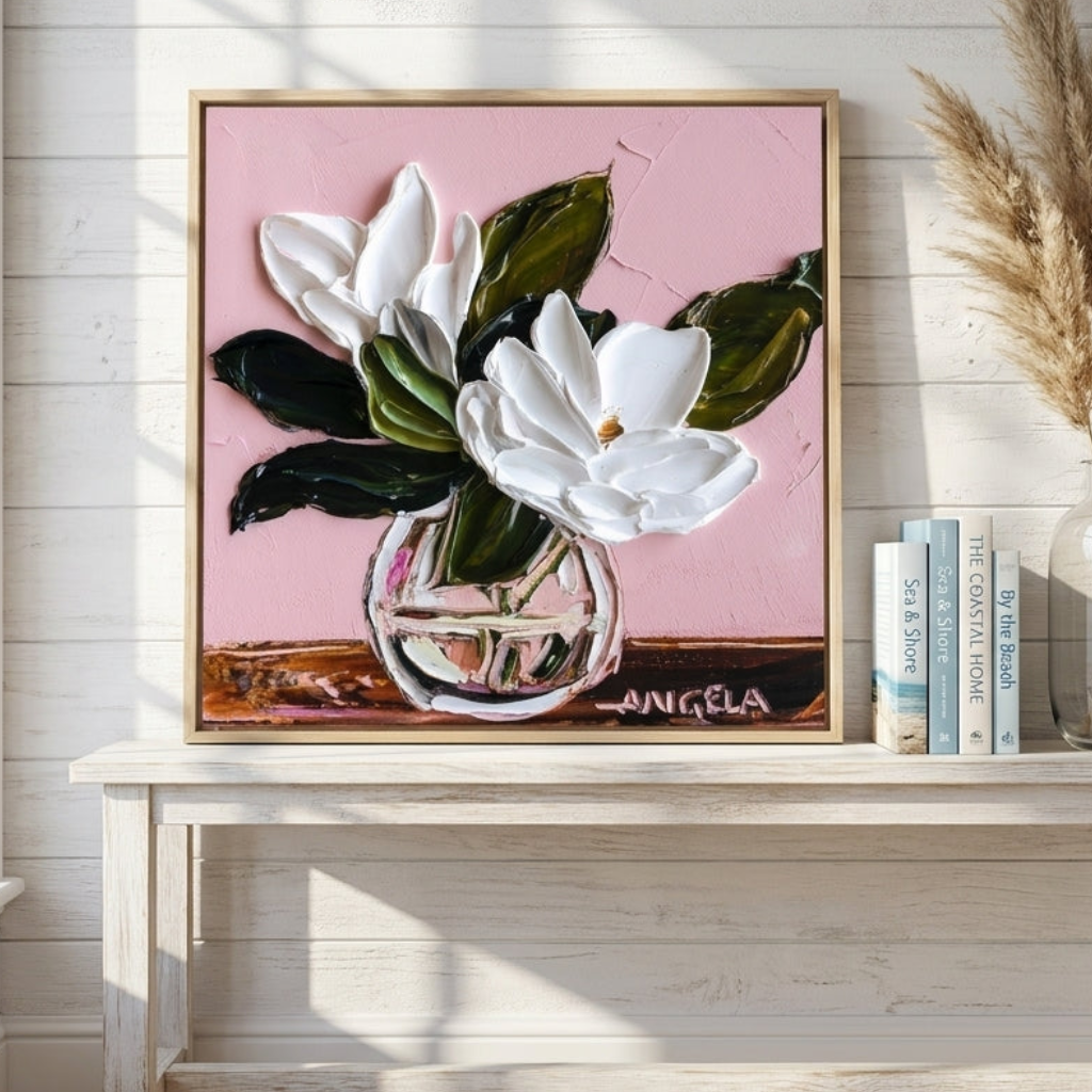 Canvas wall art with a natural timber surround standing on a console in a coastal bedroom