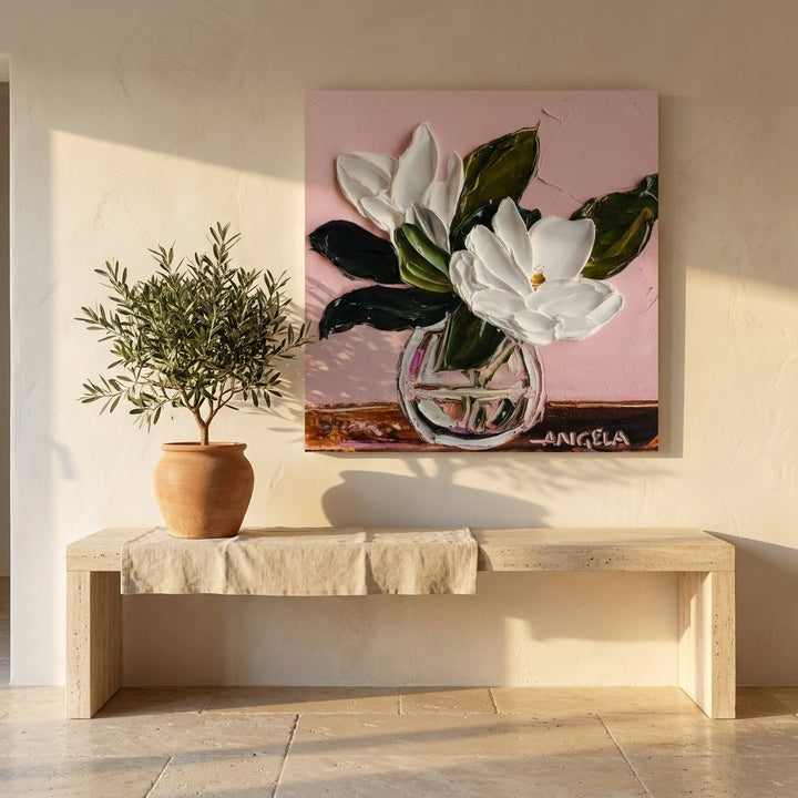 Stretched canvas wall art styled on the wall in a Mediterranean living room