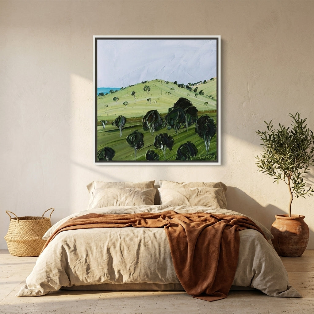 Canvas wall art with a white surround styled on the wall in a Mediterranean bedroom