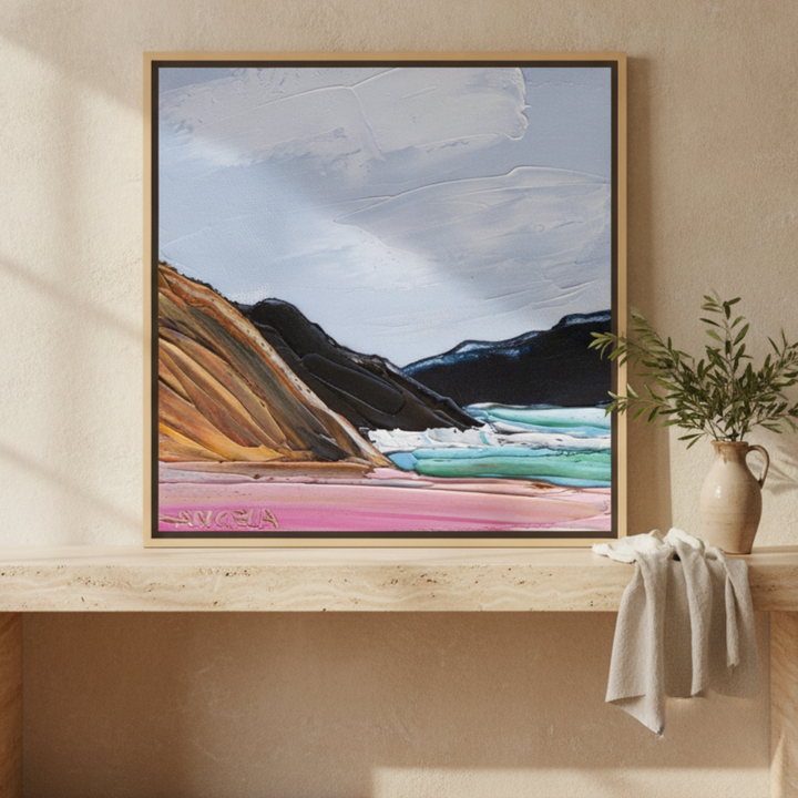 Canvas wall art with a natural timber surround standing on a console in a Mediterranean bedroom