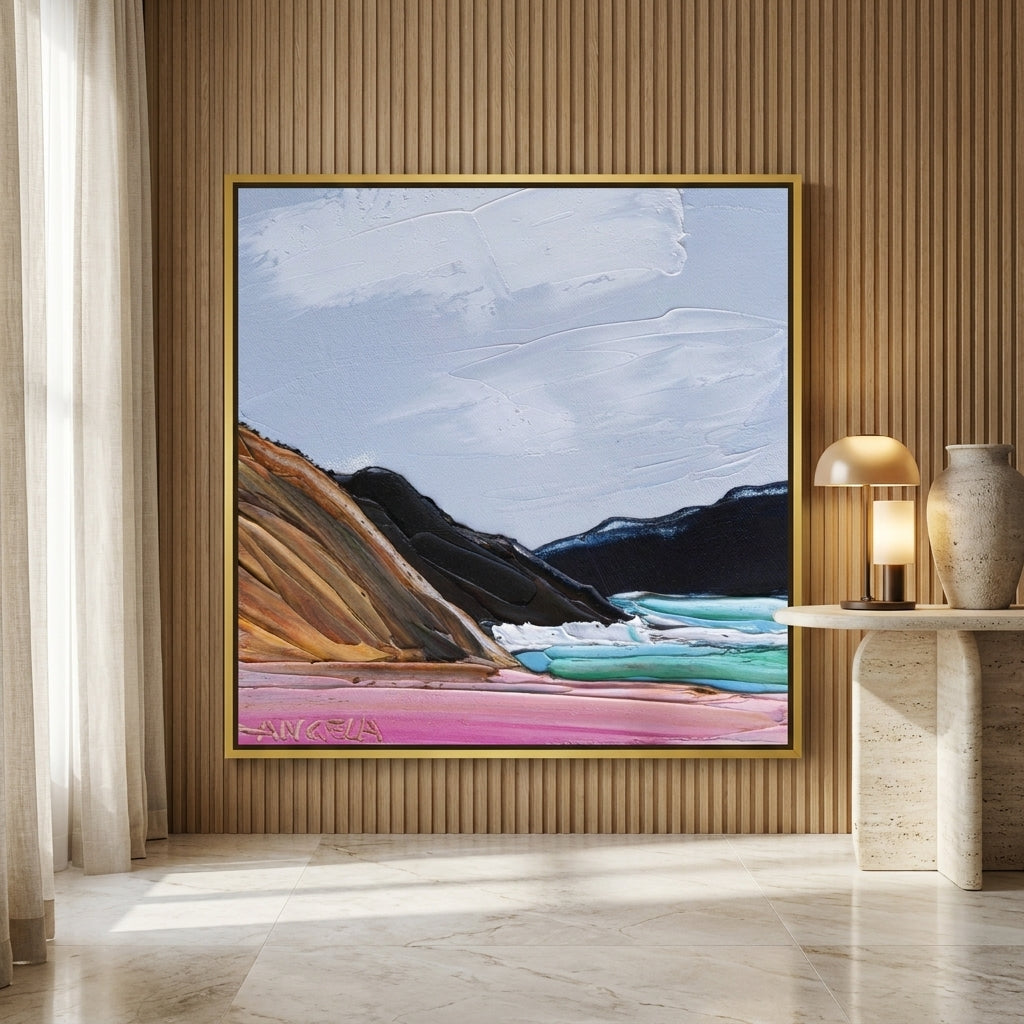 Oversized statement canvas wall art with a gold leaf surround leaning against the wall in a luxe dining room