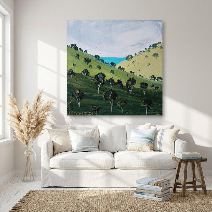 Stretched canvas wall art styled on the wall in a coastal living room