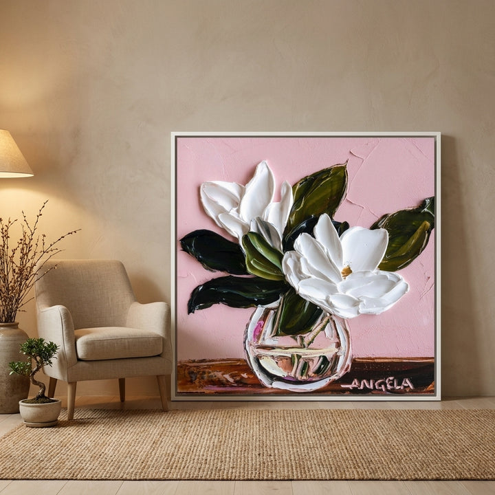 Canvas wall art with a white surround leaning against the wall in a warm Japandi bathroom