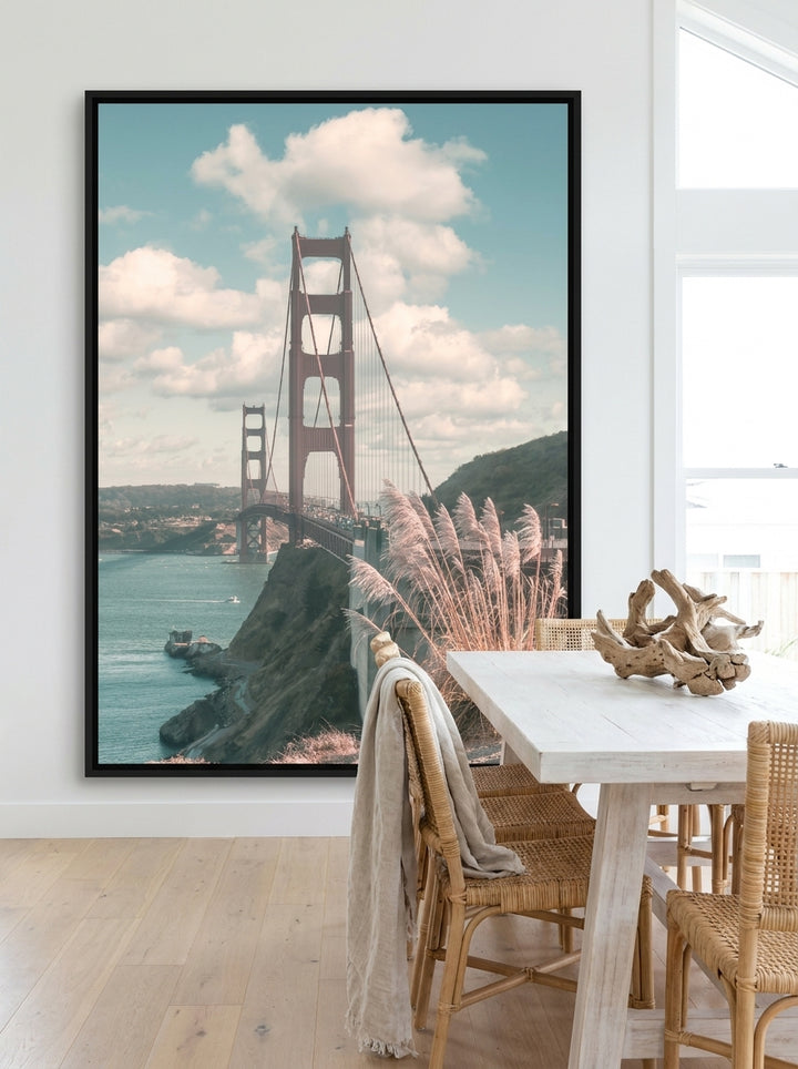 Oversized statement canvas wall art with a black surround styled on the wall in a coastal dining room