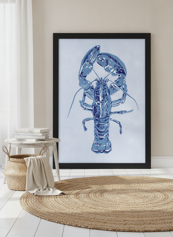 Oversized statement modern wall art print leaning against the wall in a coastal dining room