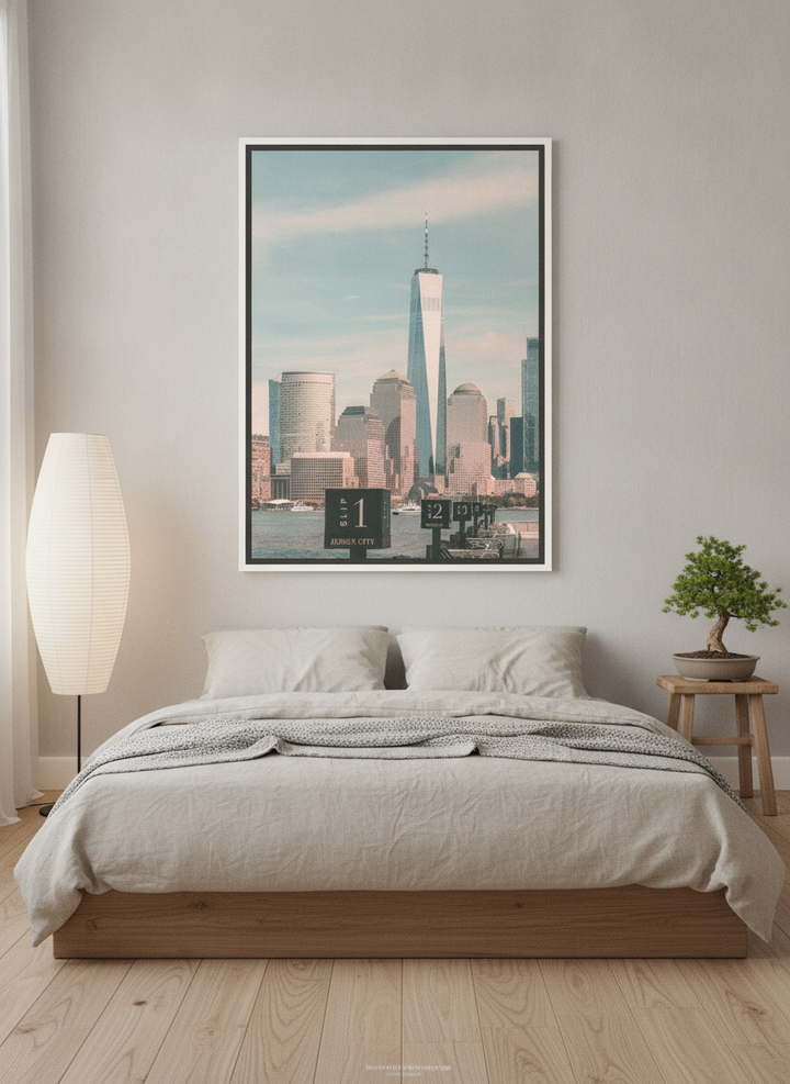 Canvas wall art with a white surround styled on the wall in a warm Japandi bedroom