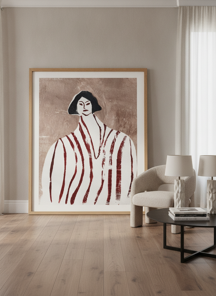 Oversized statement modern wall art print leaning against the wall in a luxe living room