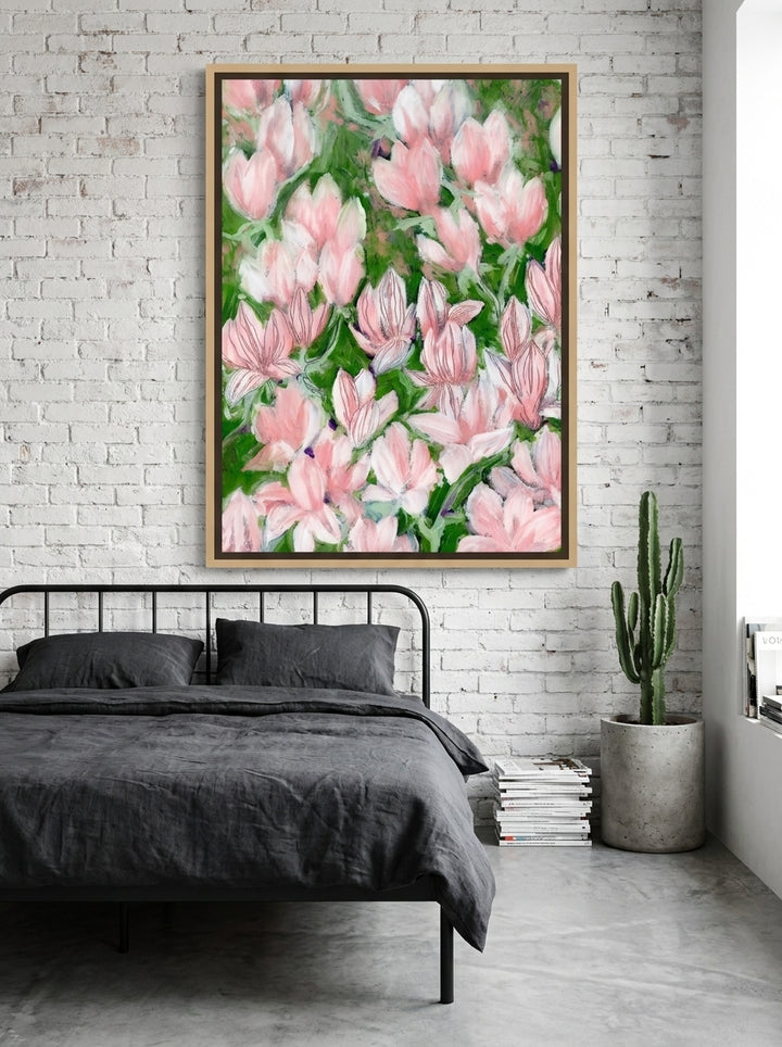 Oversized statement canvas wall art with a natural timber surround styled on the wall in an industrial loft bedroom
