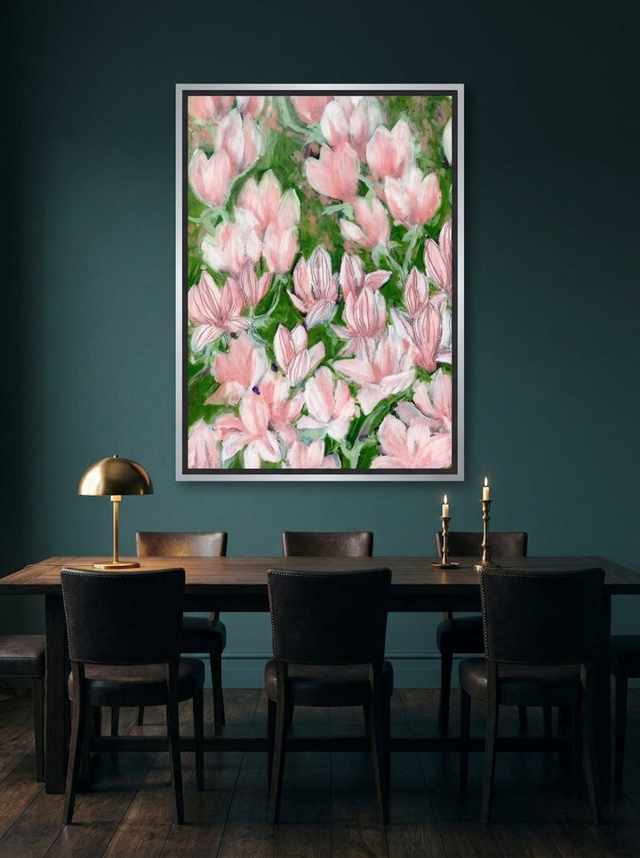 Canvas wall art with a silver leaf surround styled on the wall in a moody dining room