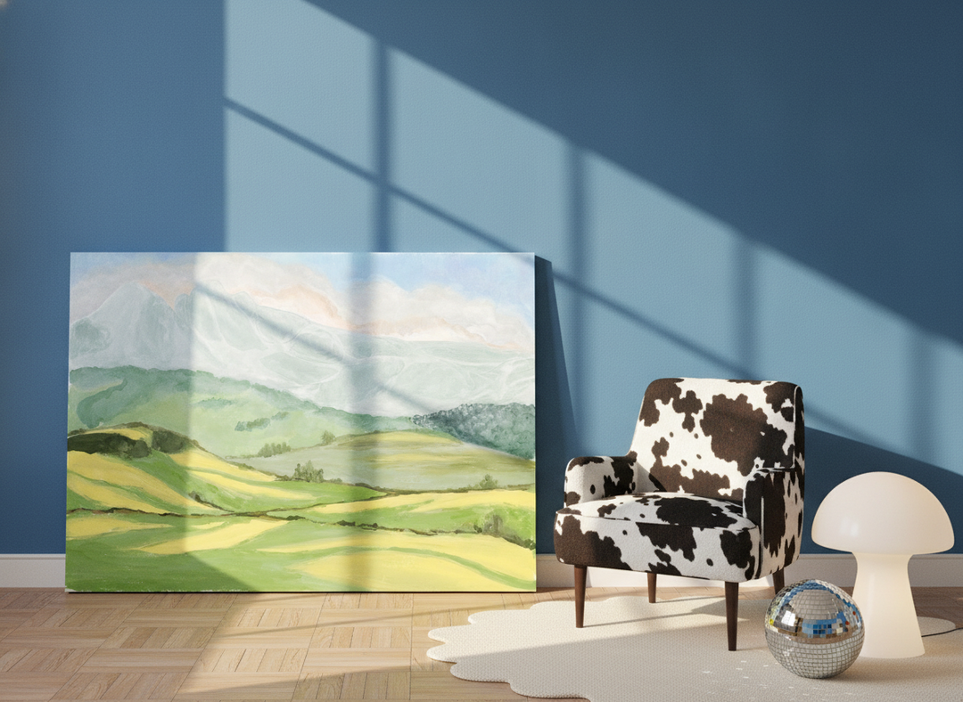 Stretched canvas wall art leaning against the wall in a colourful eclectic bedroom