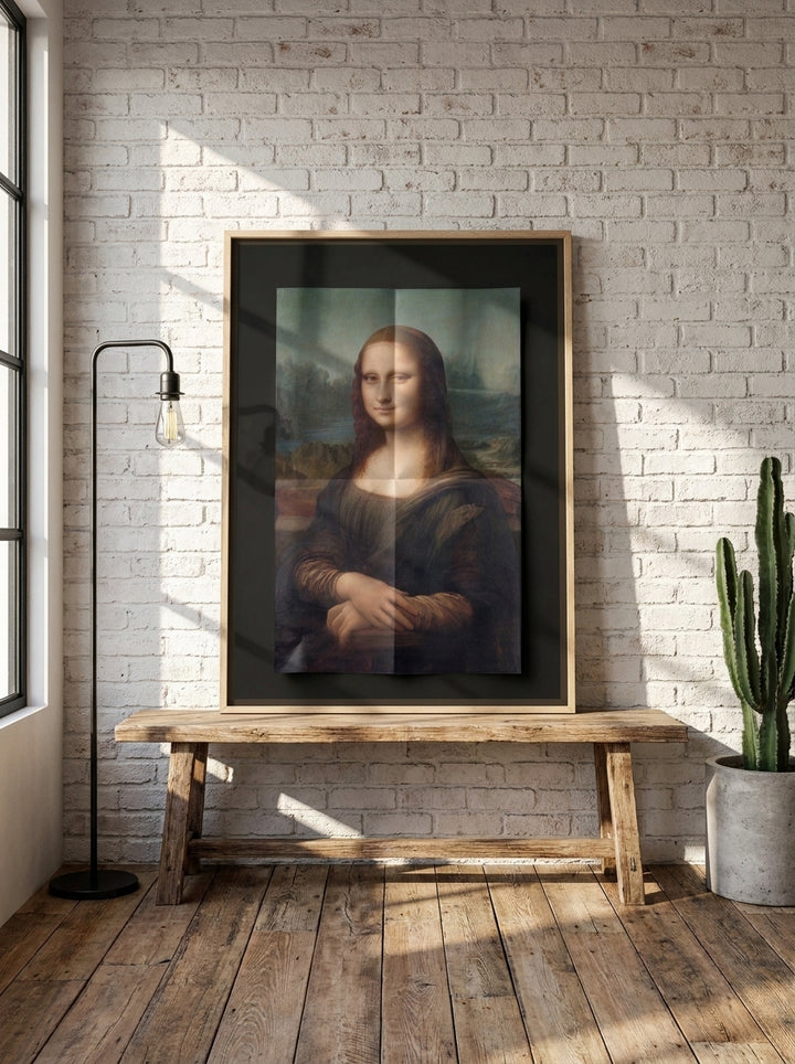 Canvas wall art with a natural timber surround standing on a bench in an industrial loft home office