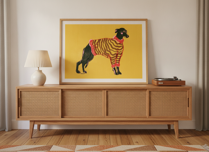 Modern wall art print standing on a sideboard in a mid-century home office