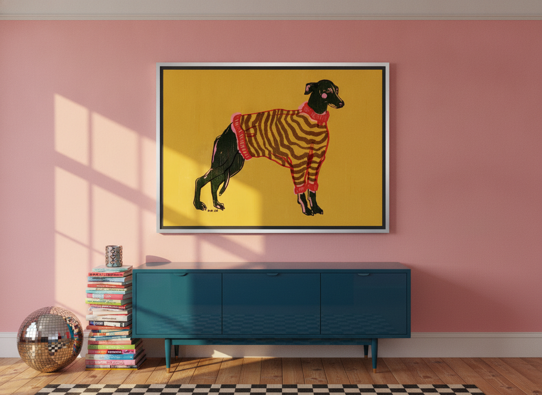 Oversized statement canvas wall art with a silver leaf surround styled on the wall in a colourful eclectic living room
