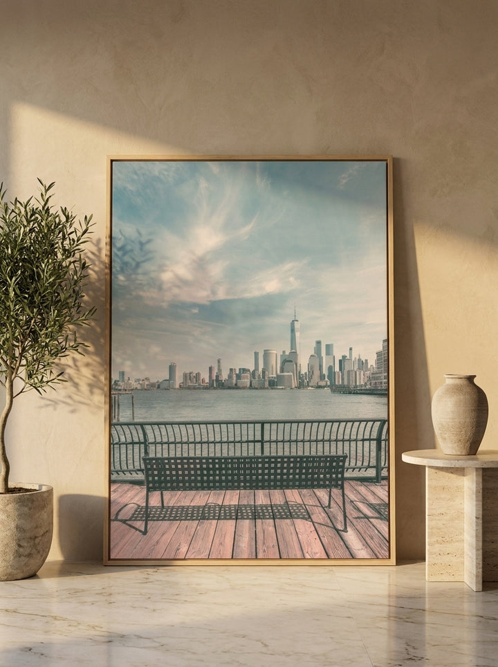 Oversized statement canvas wall art with a natural timber surround leaning against the wall in a luxe dining room