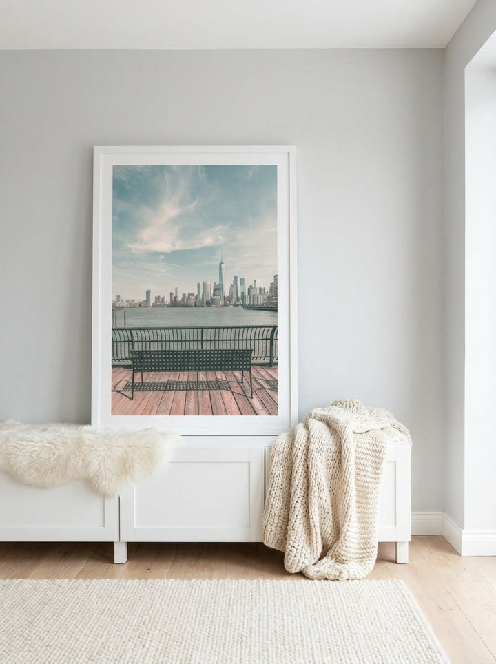 Modern wall art print standing on a sideboard in a bright Scandinavian bedroom