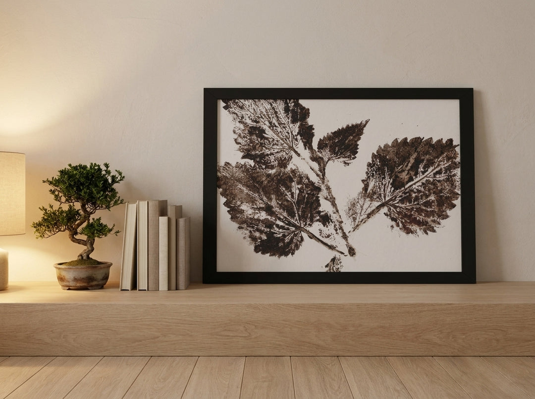 Modern wall art print standing on a shelf in a warm Japandi bedroom
