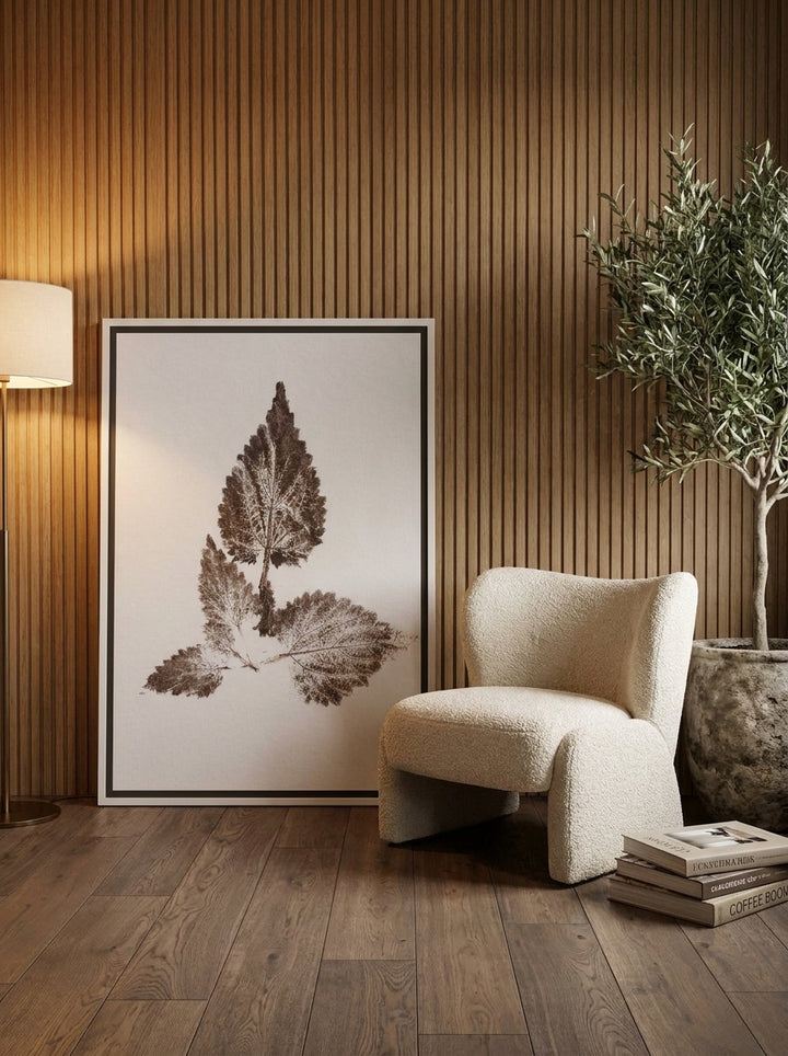 Canvas wall art with a white surround leaning against the wall in a luxe bedroom