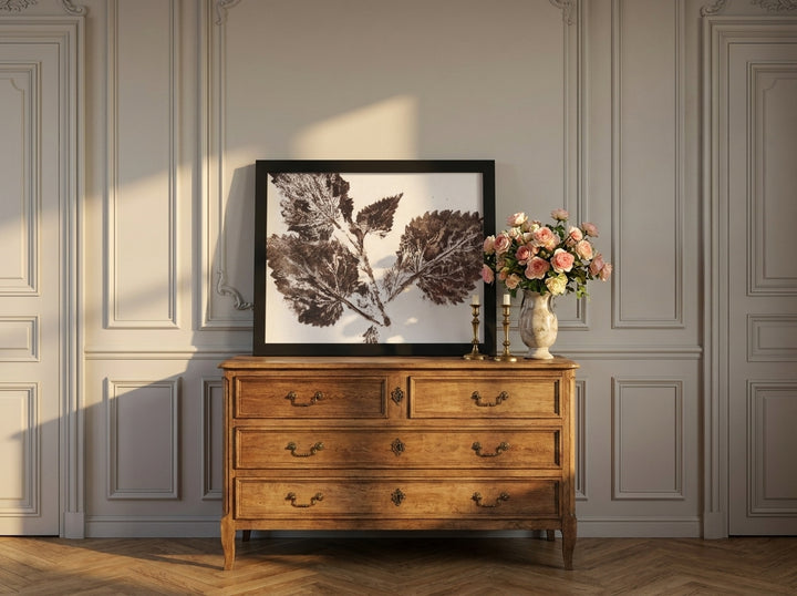 Modern wall art print standing on a sideboard in a Parisian bathroom