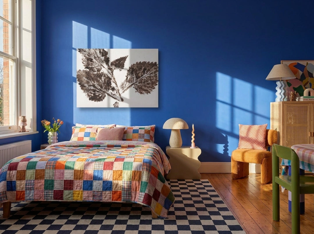 Stretched canvas wall art styled on the wall in a colourful eclectic bedroom