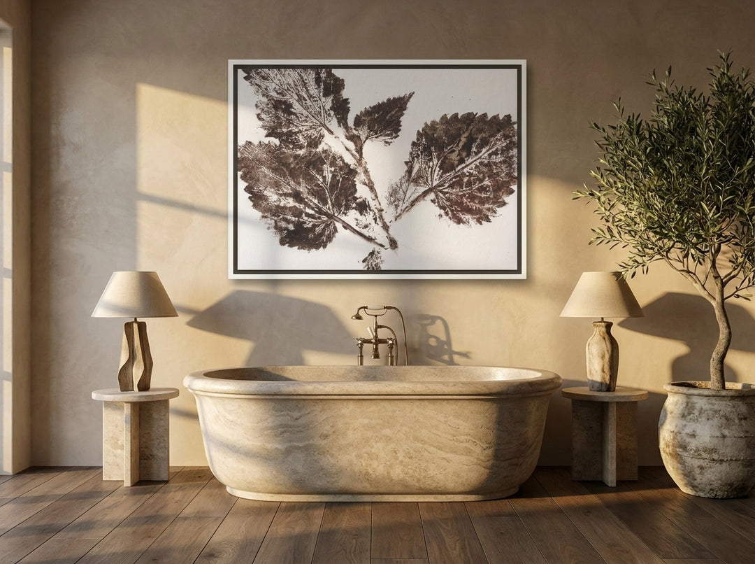 Canvas wall art with a white surround styled on the wall in a luxe bathroom