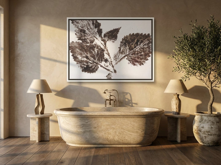 Canvas wall art with a white surround styled on the wall in a luxe bathroom