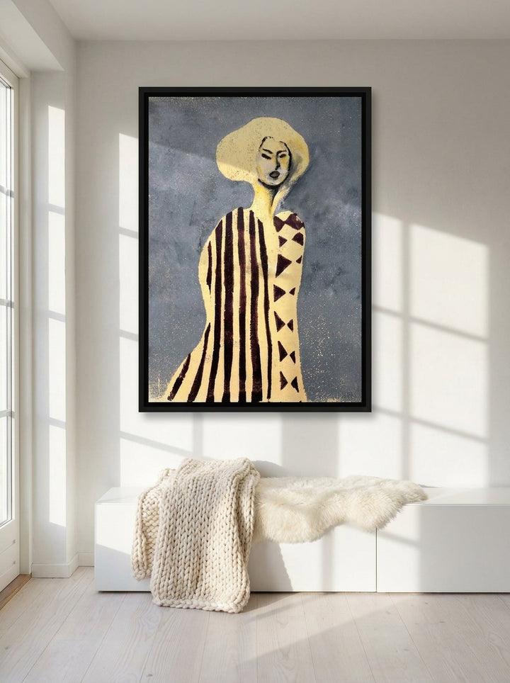 Canvas wall art with a black surround styled on the wall in a bright Scandinavian living room