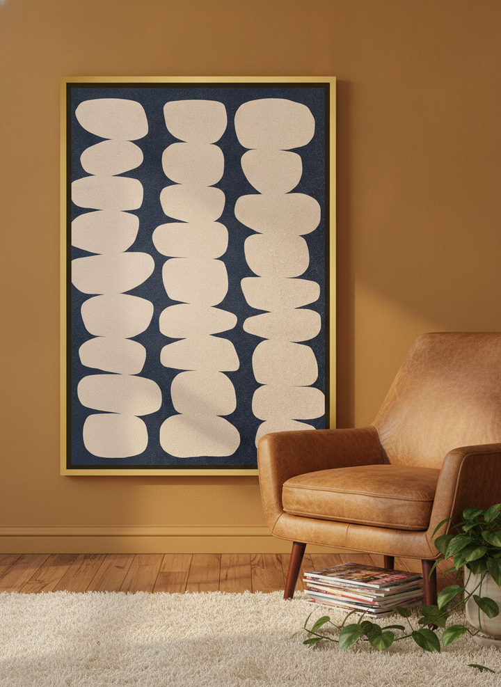 Canvas wall art with a gold leaf surround leaning against the wall in a retro 70s living room