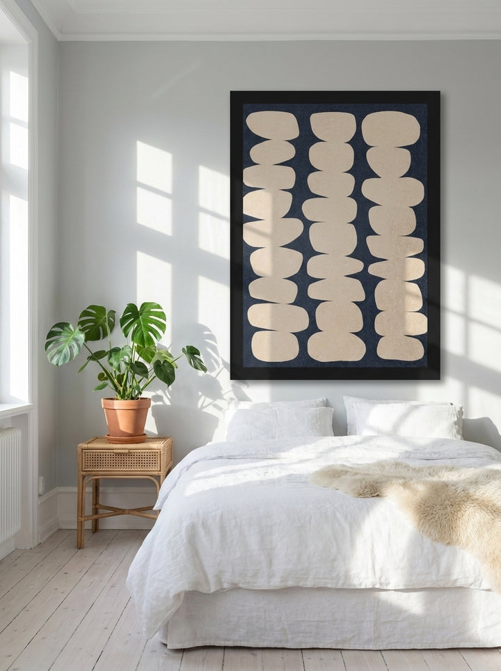 Oversized statement modern wall art print styled on the wall in a bright Scandinavian bedroom