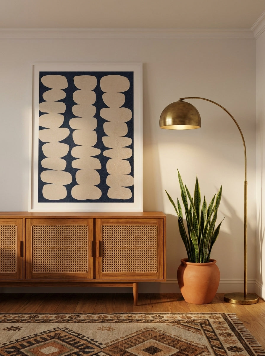 Modern wall art print standing on a sideboard in a mid-century home office