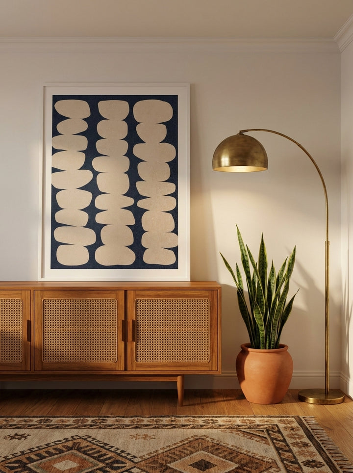 Modern wall art print standing on a sideboard in a mid-century home office