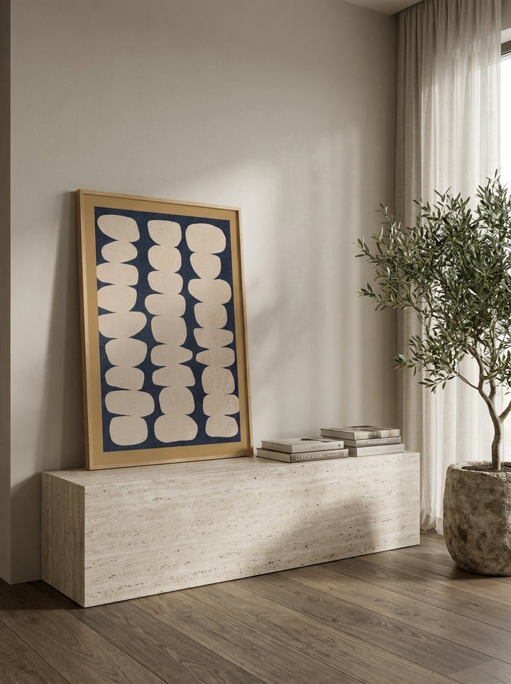Modern wall art print standing on a console in a luxe bathroom