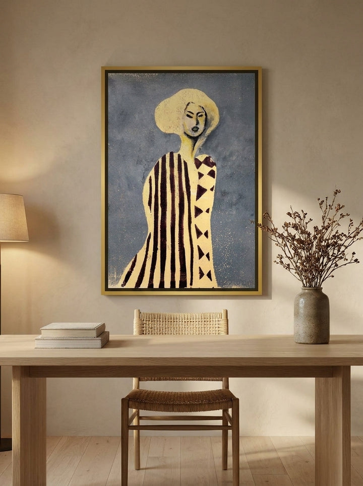 Canvas wall art with a gold leaf surround styled on the wall in a warm Japandi home office