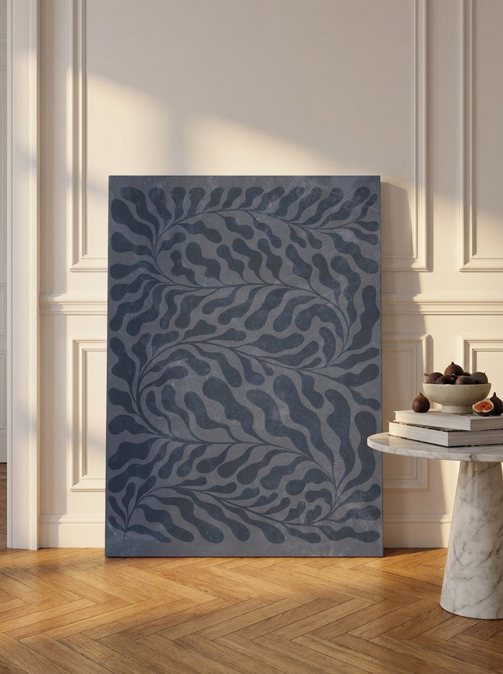 Stretched canvas wall art leaning against the wall in a Parisian living room