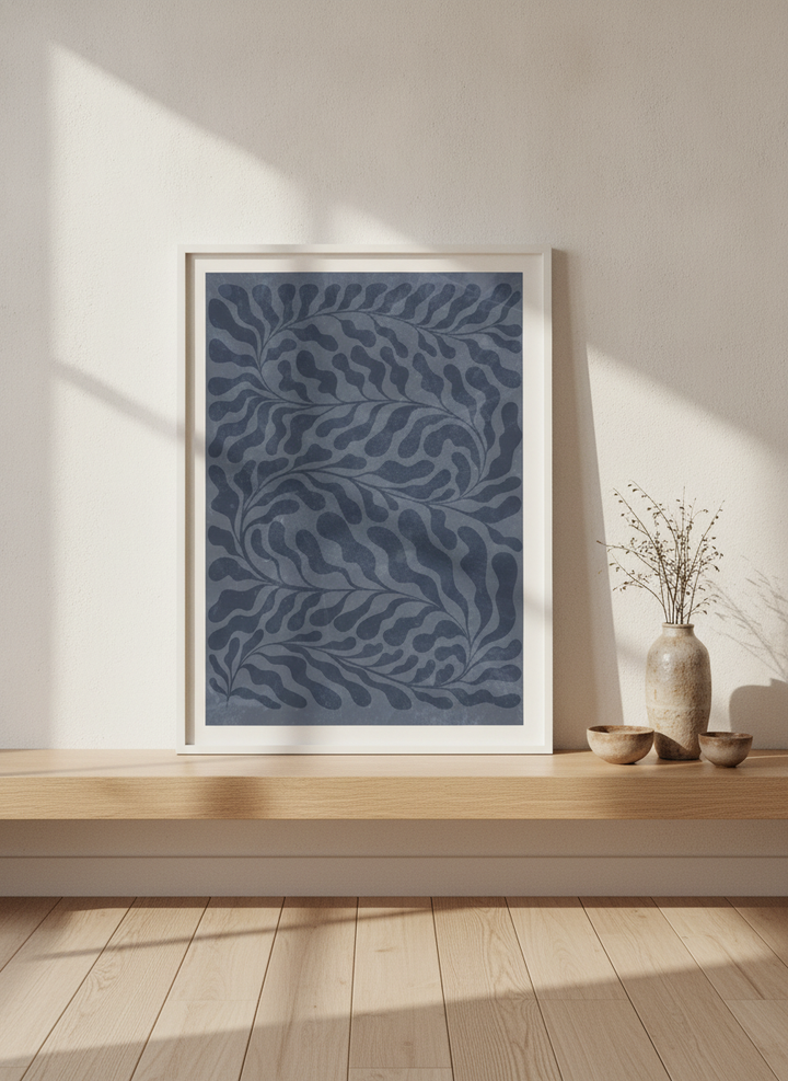 Modern wall art print standing on a shelf in a warm Japandi home office