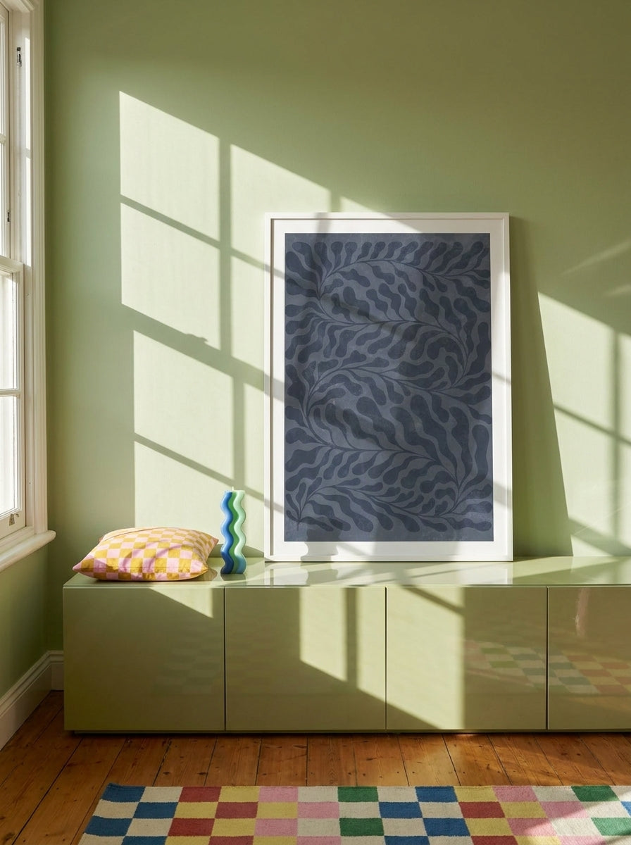 Modern wall art print standing on a sideboard in a colourful eclectic home office