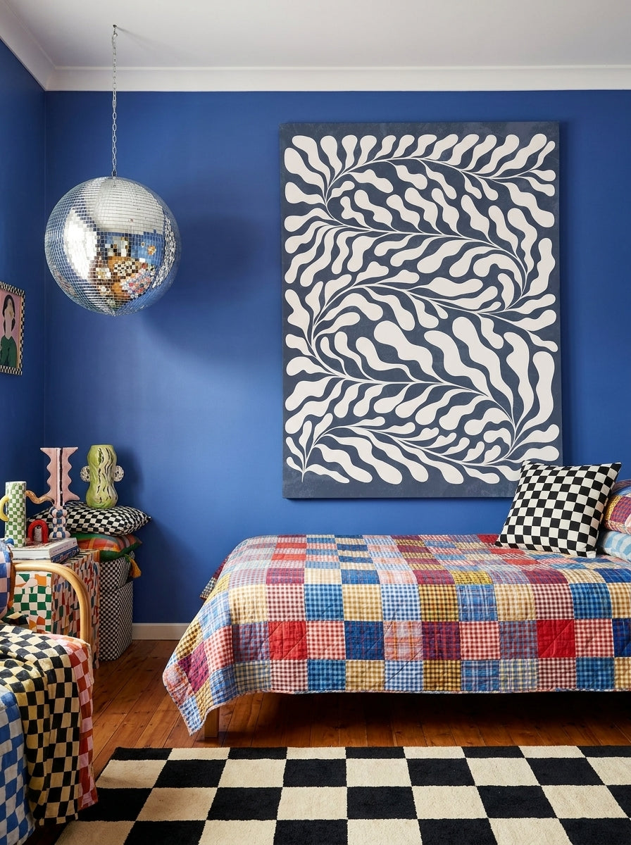 Stretched canvas wall art styled on the wall in a colourful eclectic bedroom