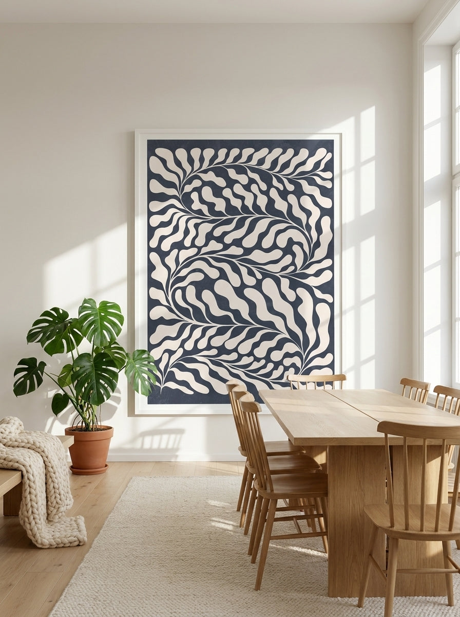 Oversized statement modern wall art print styled on the wall in a bright Scandinavian dining room