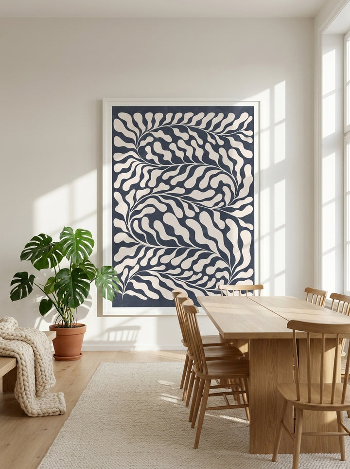 Oversized statement modern wall art print styled on the wall in a bright Scandinavian dining room