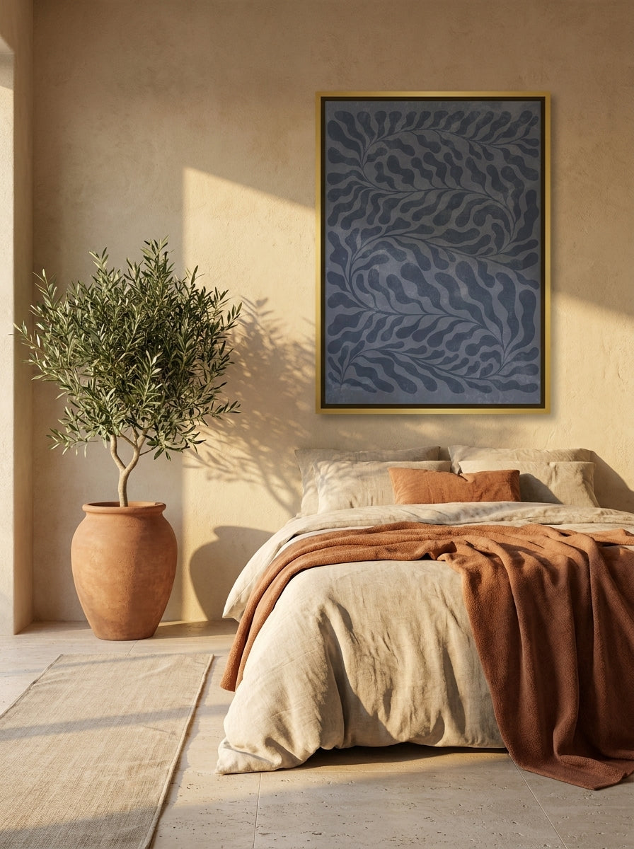 Canvas wall art with a gold leaf surround styled on the wall in a Mediterranean bedroom