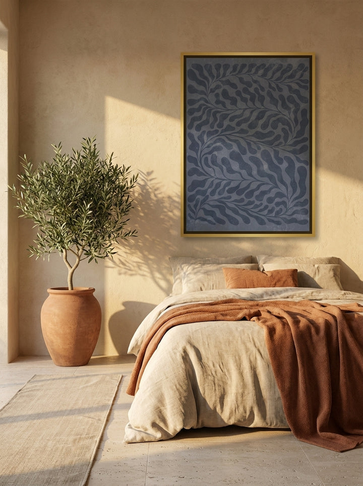 Canvas wall art with a gold leaf surround styled on the wall in a Mediterranean bedroom